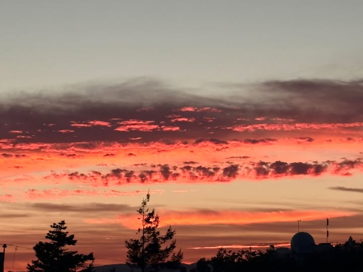 A fiery red and orange sunset seen from Gonzales Hill